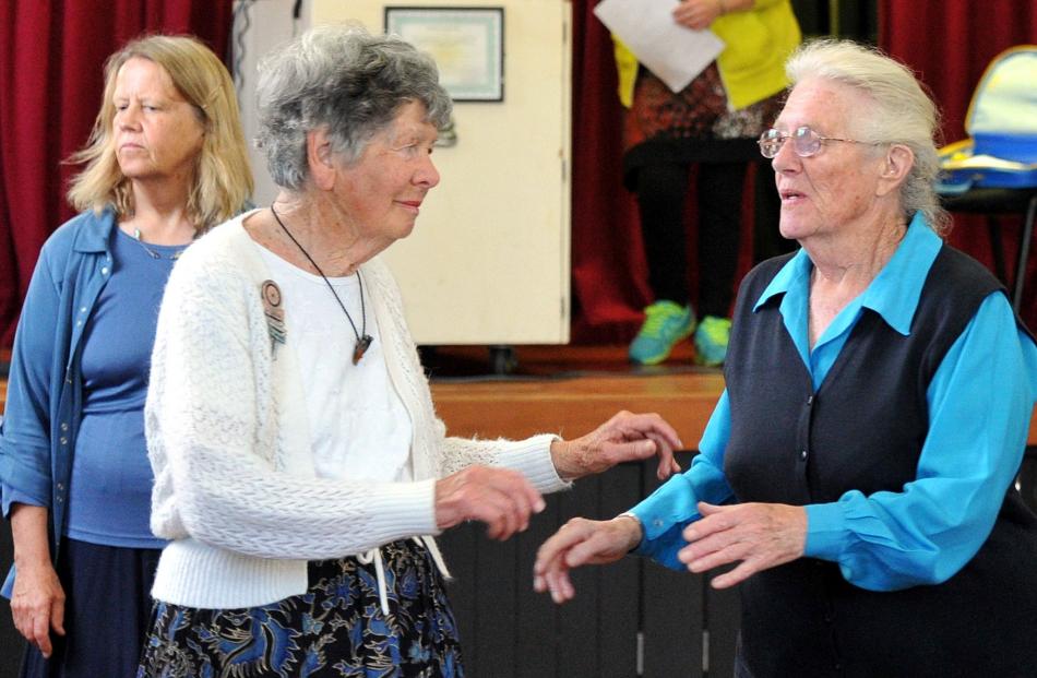 Sally Weston (left) and Theresa Gardiner perform a square dance. Photo by Gregor Richardson.
