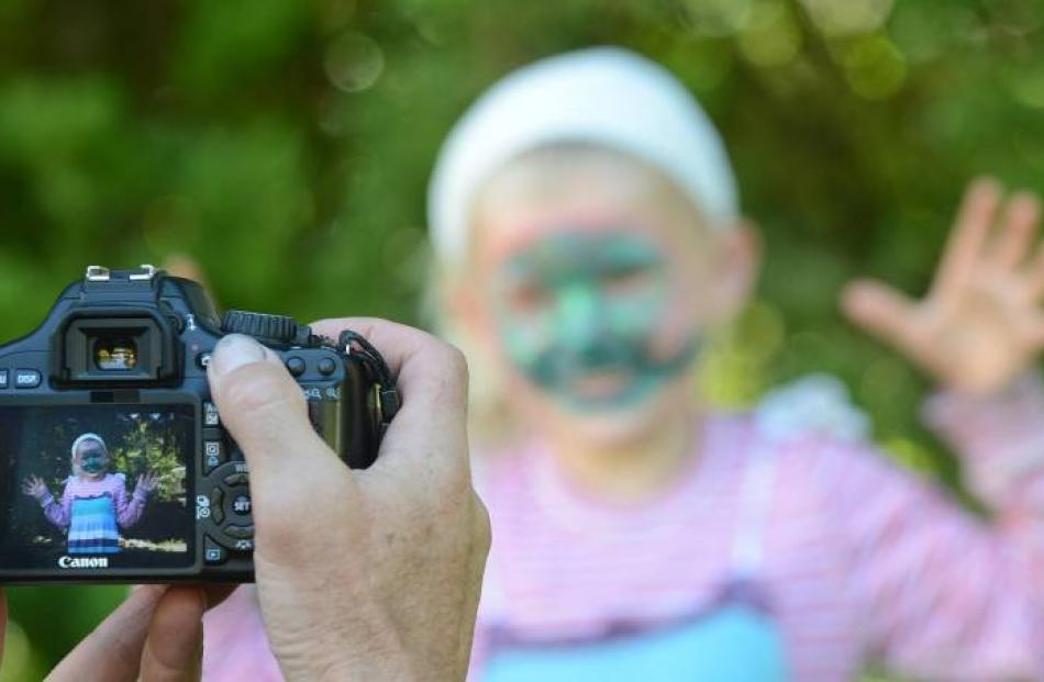 Dunedin's Shaun Templeton photographs his daughter Luka (6)  at the  festival.