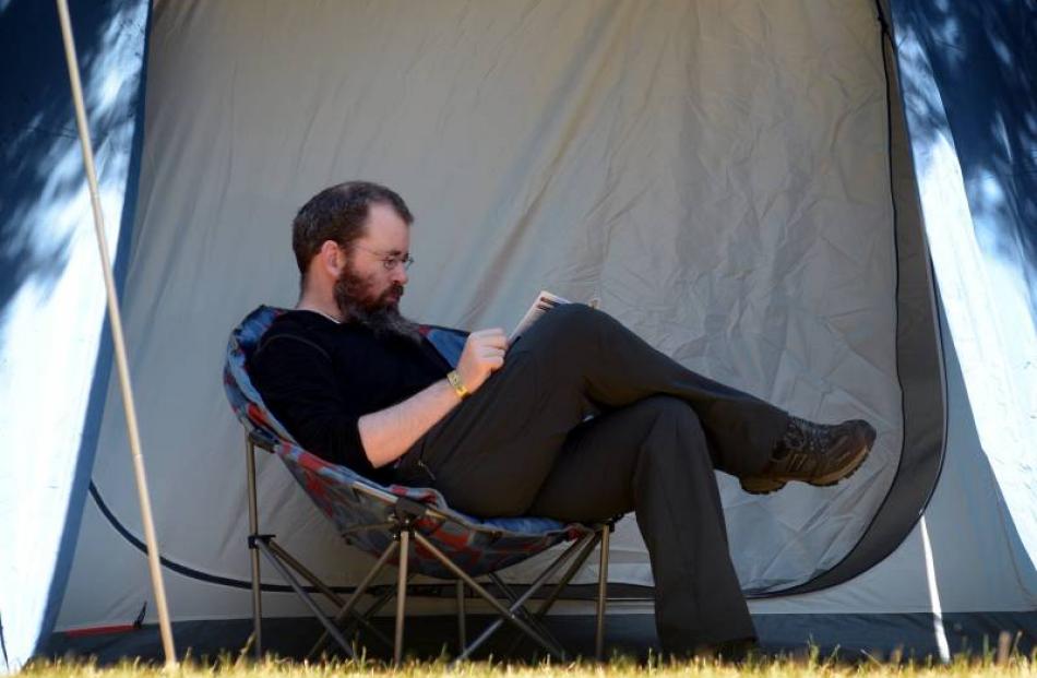 Simon Evans, of Wellington, relaxes at the festival.