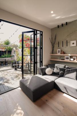 Bifold doors open from the lounge to the courtyard and garden.