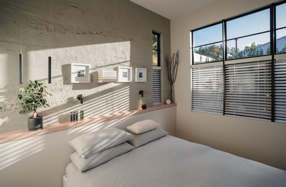 Roughcast concrete panels add texture and contrast to the interior.