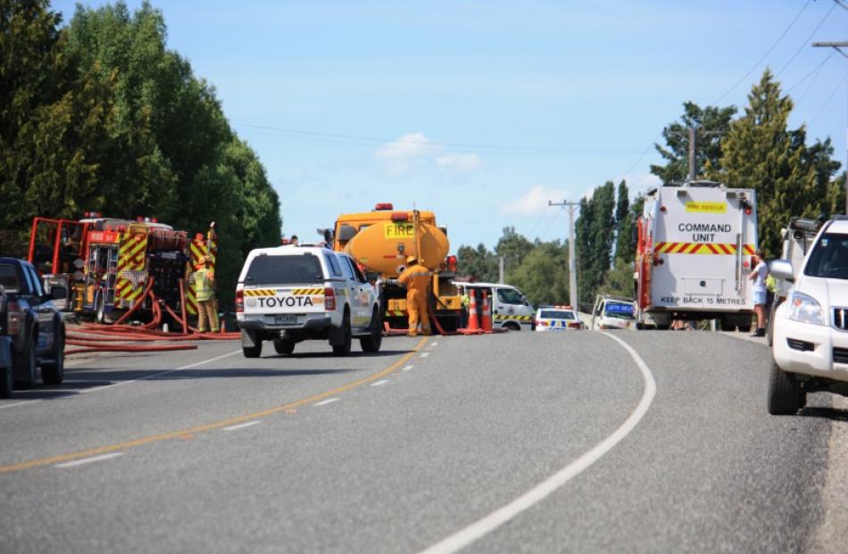 Alexandra Volunteer Fire Brigade, Otago Rural Fire Authority, and police vehicles outside the...