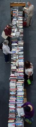Keen readers dig through the mountains of titles for their next read.