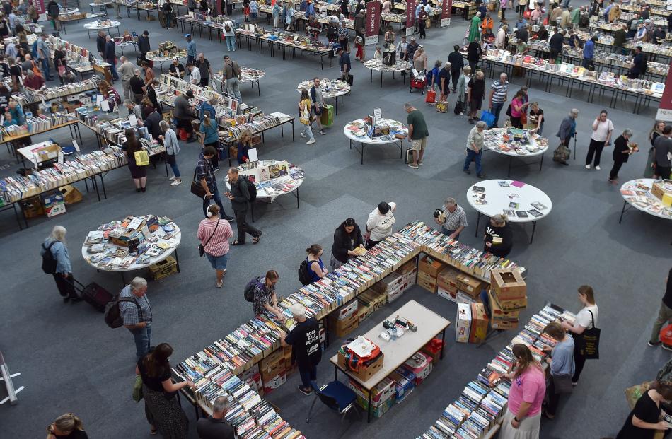 People crowd the different stalls to find their perfect book.