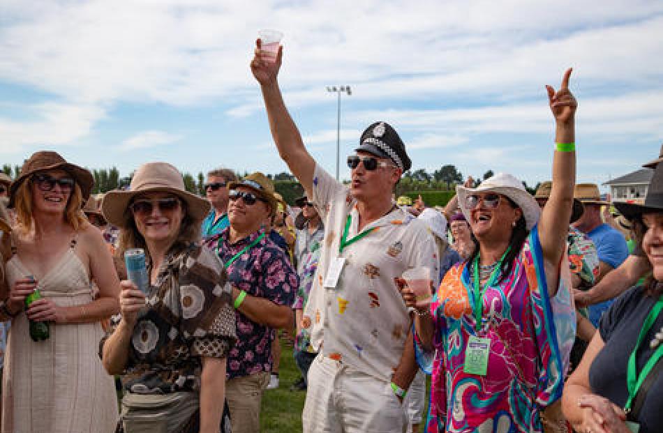 Festival goers having fun in the sun. Photo: Neil McIntosh