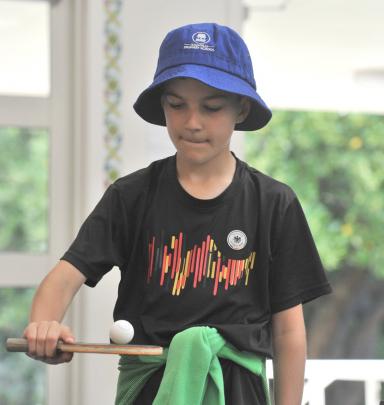 Kaikorai Primary School pupil Matteo Kennedy, 9, balances a ball on his table tennis paddle.