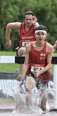 French Polynesia’s under-20 steeplechase winner Felice Covillon takes a dip.