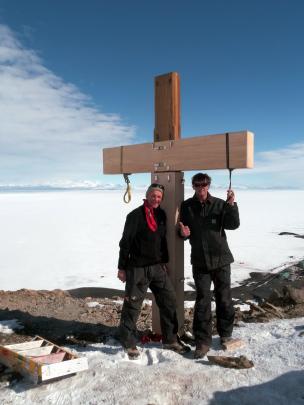 Darryn Slee (right) and Torbjoern Prytz  fit a cover for Scott's Cross on Observation Hill.