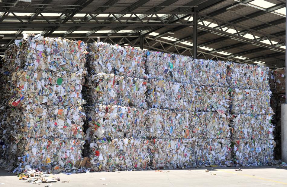 Bales of recycled plastic and paper ready for export at the Green Island recycling plant.
