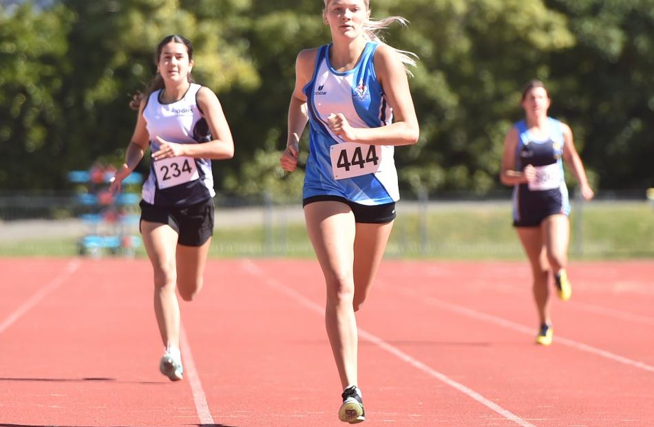Queen’s High School runner Seddah McGregor, 15, charges to victory in the 400m at the Otago...