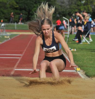 Taieri College long jumper Jane Lindsay, 16, who lands in the sand.