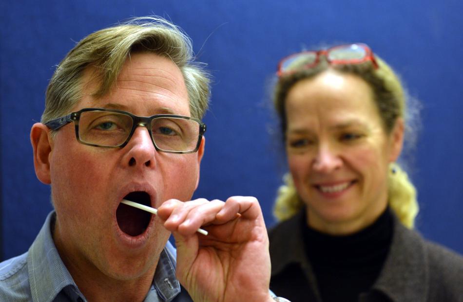 Otago Daily Times reporter Bruce Munro (47) takes a DNA swab,  watched by Prof Lisa 
...