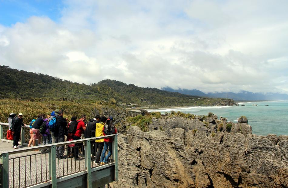 Tourists flock to photograph the  pancake stack rock formations at Punakaiki, on the West Coast...