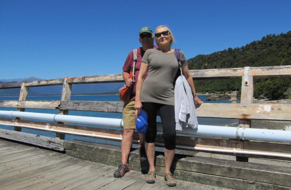 English tourists Roger and Lynda Goddard-Coote at Jackson Bay say "no" to a new road.