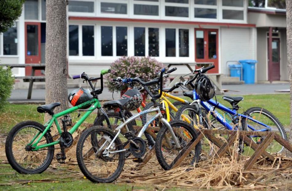 Half of the pupils rode their bikes to school that day. The sole classroom is visible behind the...