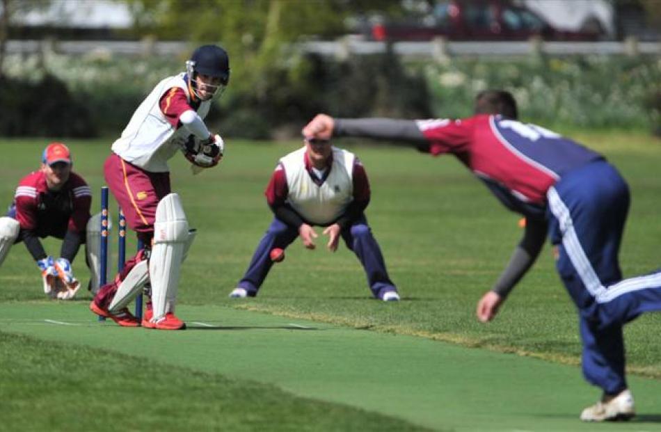 Tim McCormick, of Carisbrook-Dunedin, bowls to Simon Murley, of North East Valley, while...