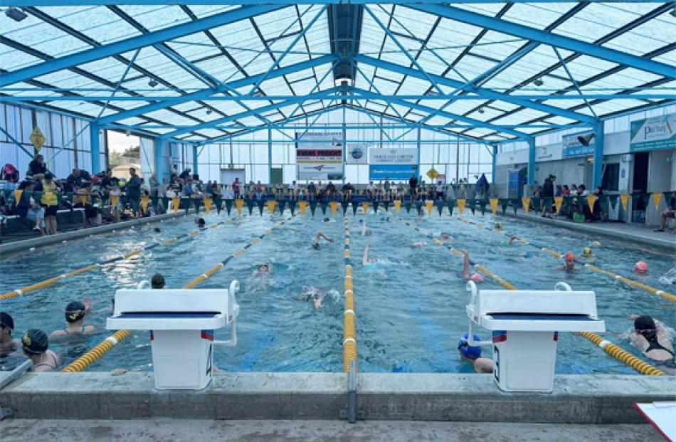 Relay race in action at the recent Town vs Country meet for upcoming swimmers at the Fiordland...