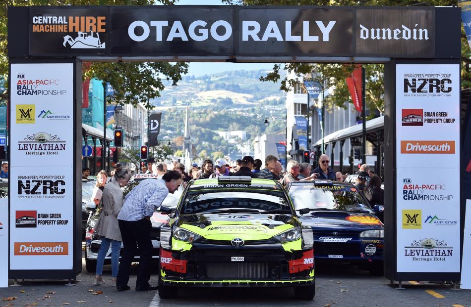Dunedin Mayor Jules Radich views the rally cars on show in the Octagon before the Otago Rally...