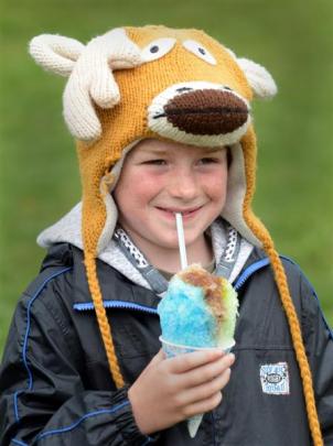 Isaac Lawrence (7), of Outram, enjoys a slushie, despite the cold yesterday.