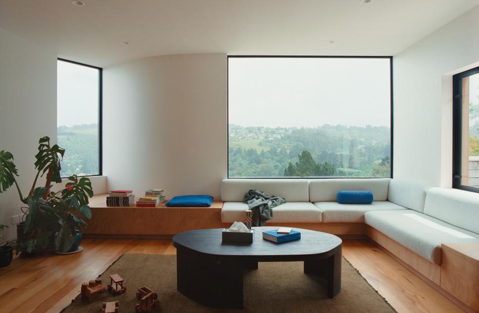An inbuilt couch in the lounge is the ideal spot to linger while watching the ever-changing weather.