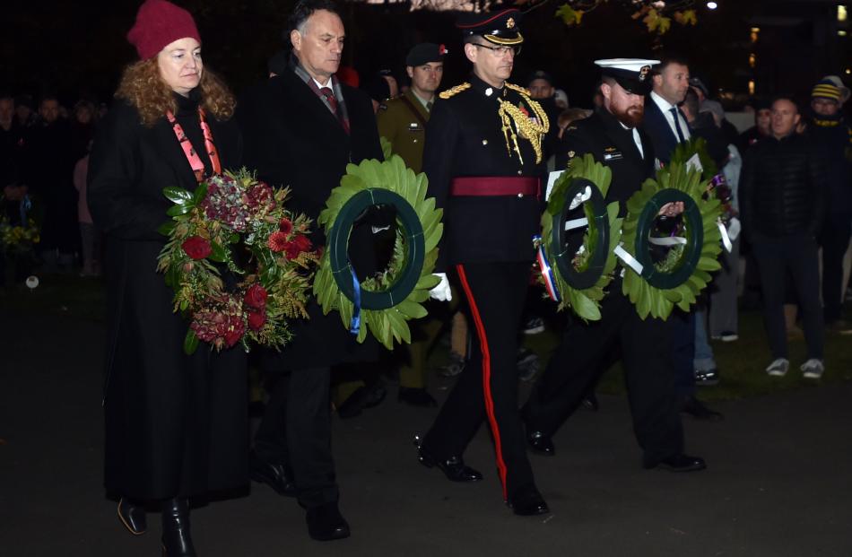 MPs and representatives bring forward their wreaths.