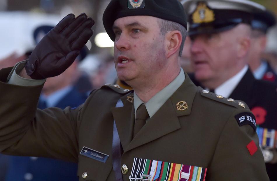 Capt Beker salutes the Cenotaph.
