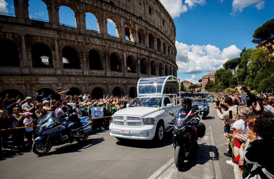A hearse carries the coffin of the Pope to the Papal Basilica of Saint Mary Major, passing by the...