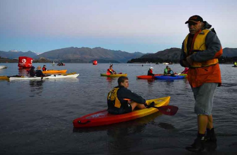 Bill Godsall oversees the kayak-based water rescue team as they wait in ideal conditions for the...