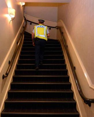 Sgt Paulin prepares to do a head count in a bar.