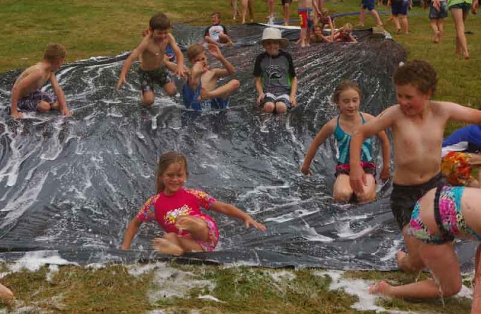 Children proved that the simple pleasures are the best. The DIY slip and slide was popular with...