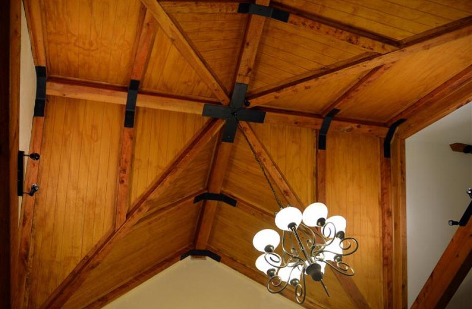 A glass ceiling was planned for the dining area but budget constraints saw it made in macrocarpa...