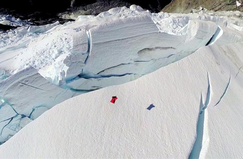 David Walden  flies low over the Rob Roy Glacier, chasing his shadow.