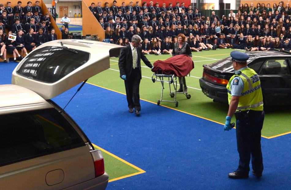 Hope and Sons funeral directors John Finlayson (left) and Donna Jenkins take a simulated dead...