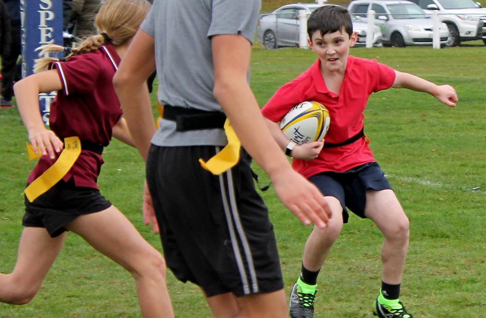 Romeo Robson-Walker, 12, of Rosebank School eyes the upcoming gap, in the split-second of...