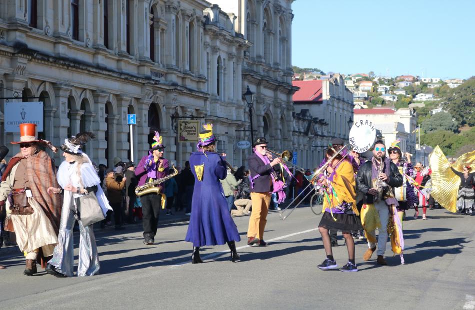 The brass band Crash Bandihoot play in the street parade.
