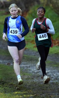Under-19 girls competitors Emily-Rose Young (439), of Queen’s High School, and Virtuous Tabe (440...