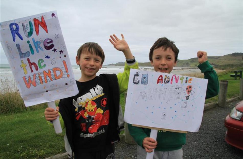 Riley (6), left, and Callum Wilson (8), of Gore, show their support for their aunt Monica Wilson,...