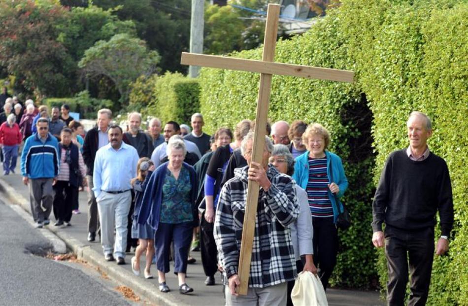 Bill Steele leads the Mornington Good Friday procession between St Francis Xavier Catholic and St...