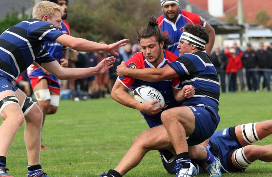 Harbour centre Alexi Morris to pulled down just short of the line by Kaikorai flanker Johnny...