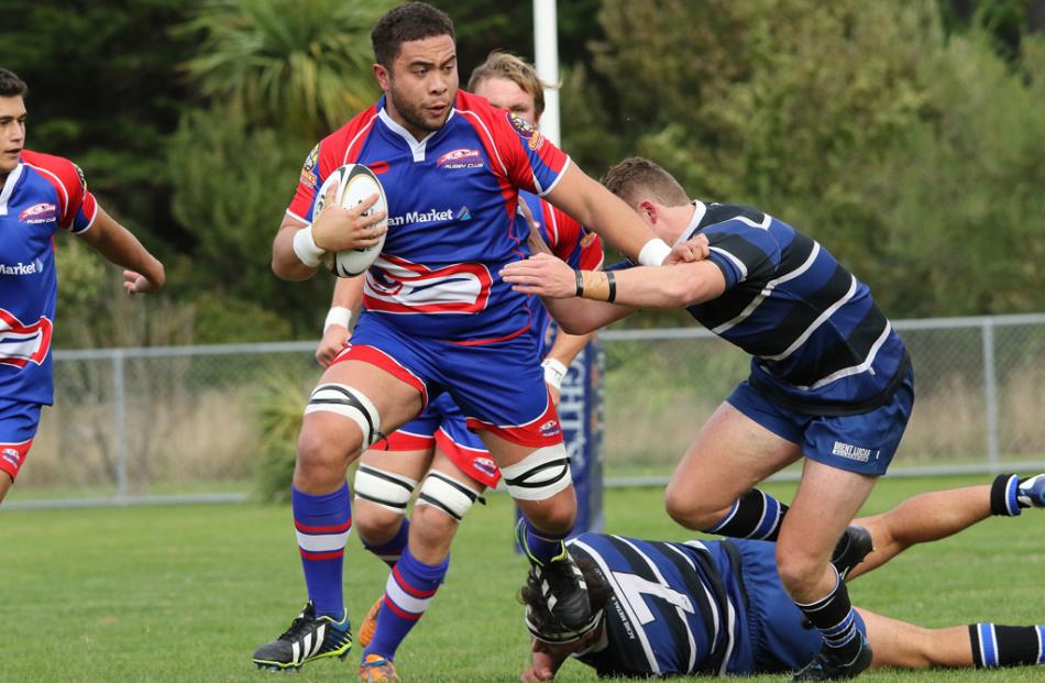 Harbour No 8 Solomon T-Pole steps out off Kaikorai flanker Johnny Applebys tackle while fending...