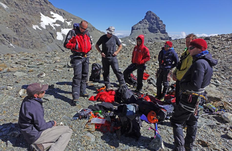 Queenstown Alpine Cliff Rescue team members plan a search for the body of missing Wellington...