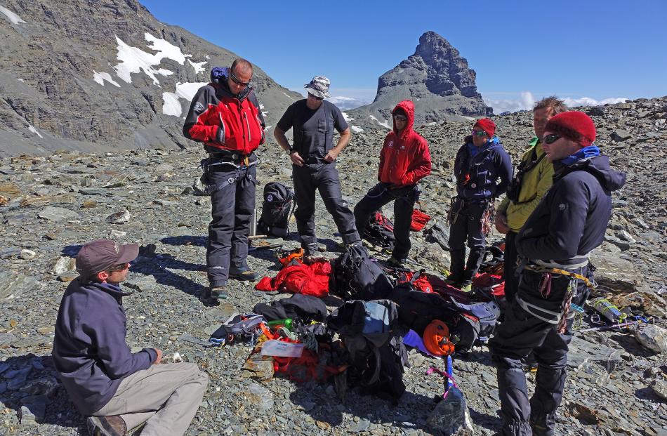 Queenstown Alpine Cliff Rescue team members plan a search for the body of missing Wellington...