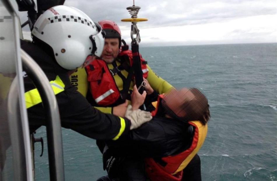 One of two hypothermic men rescued yesterday after clinging to a capsized kayak for up to four...