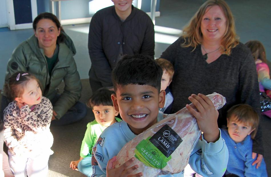 Neithen Ronish, 4, lifts the trophy on behalf of Balclutha Kindergarten. 