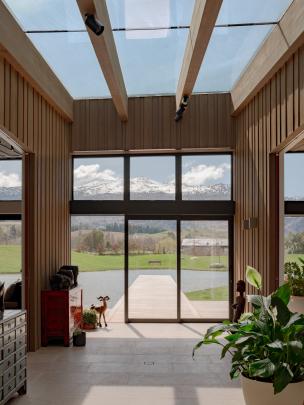 From the front door, there is a direct line of sight through the conservatory to the jetty and...