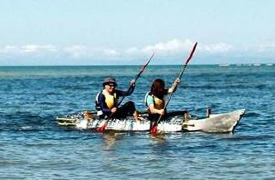Ms  Mun (front) and team mate Dan Cullum paddle through the Abel Tasman.