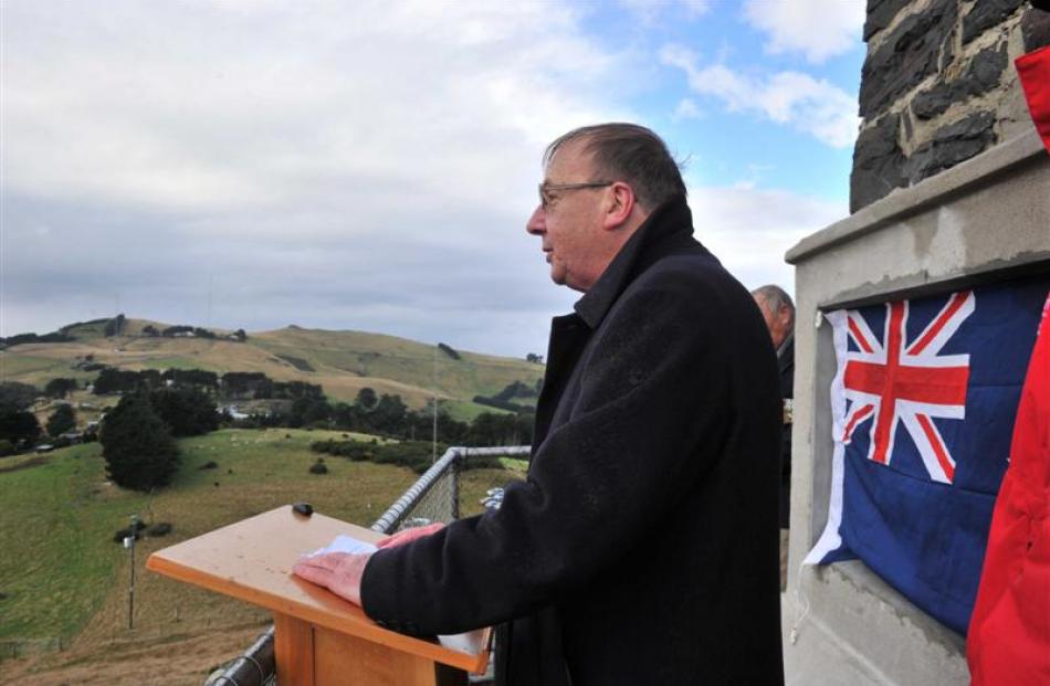 Author and historian Ron Palenski speaks during the unveiling of a new plaque at the Otago...