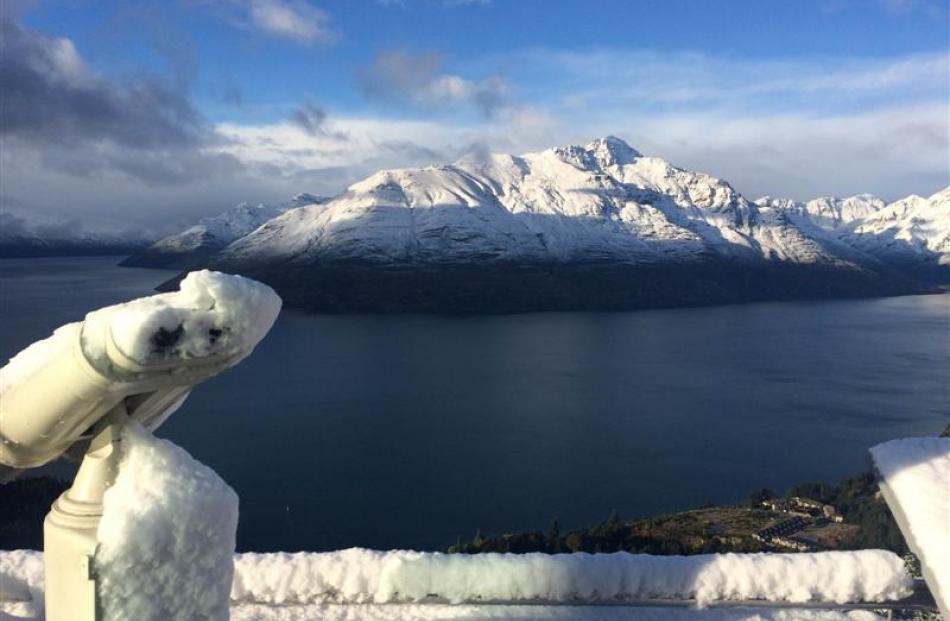 A view of a snow-capped Cecil Peak across Lake Wakatipu from Skyline Queenstown.