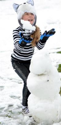 Sarah Harris (11), of Tapanui, plays in the snow.