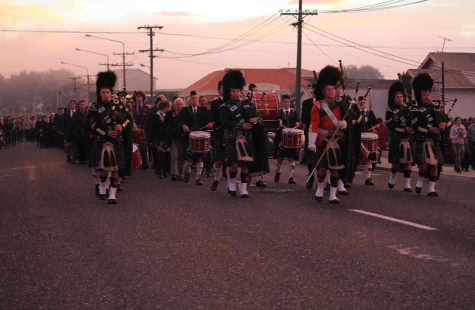 100 years on . . . The Balclutha Pipe Band leads a parade of about 500 down Renfrew St in...